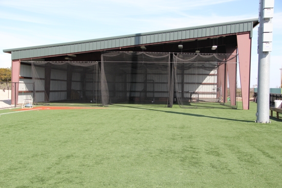 Covered batting cages gives ample room to perform hitting stations and practices